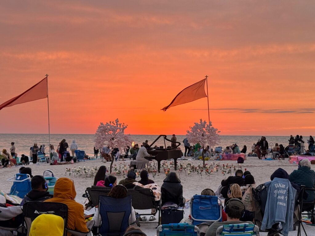 pianist playing outside at dusk